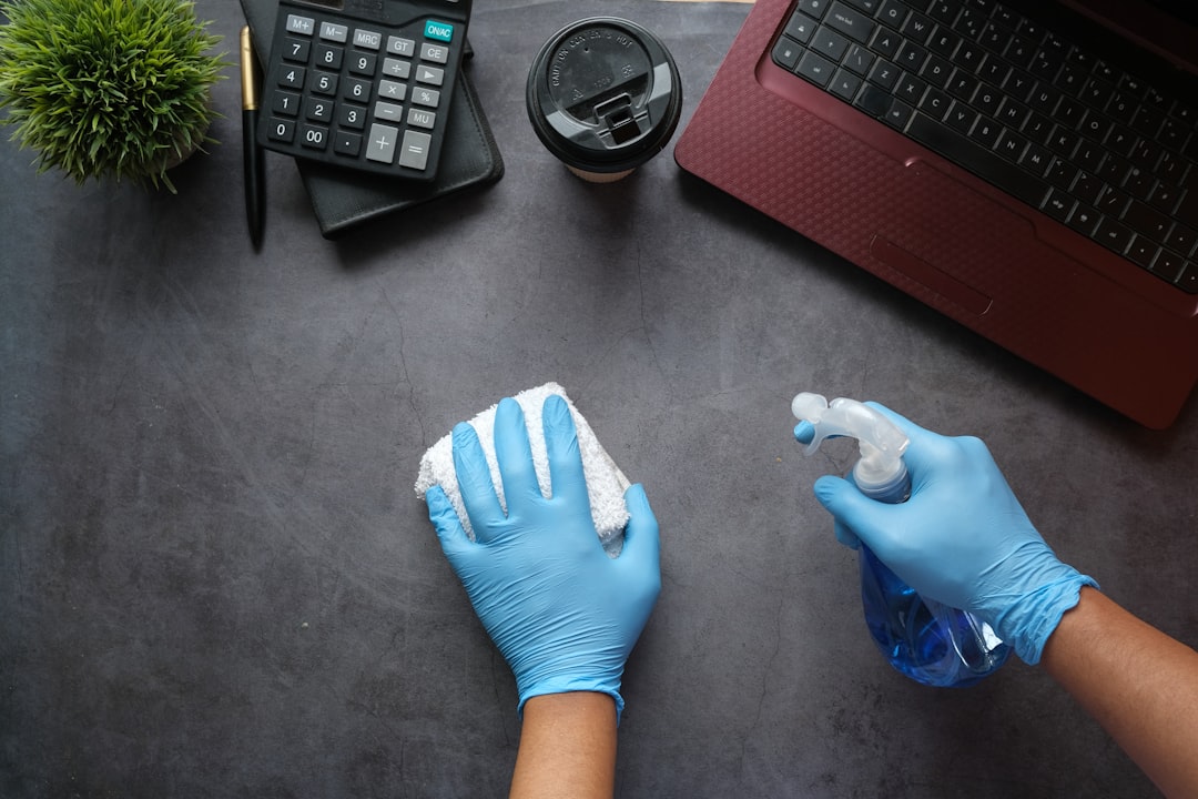 contact-img person-in-blue-long-sleeve-shirt-sitting-beside-black-laptop-computer-9gpkrsbgmc